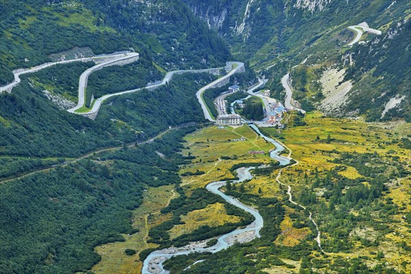 View from the Rhone glacier of the glacial stream and the pass roads