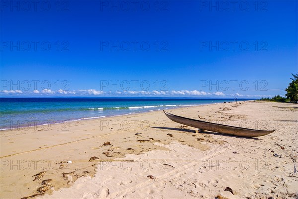 Canoe on a white sand beach on the Island Ile Sainte-Marie although Nosy Boraha