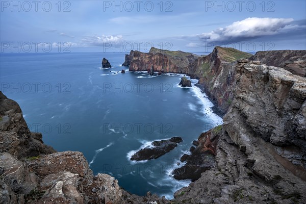 Red cliffs and rocks in the sea