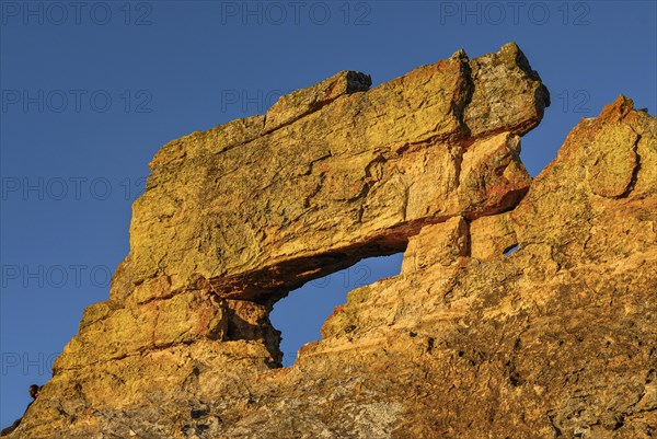 Savannah and huge rock formations at sunset in the Isalo National Park