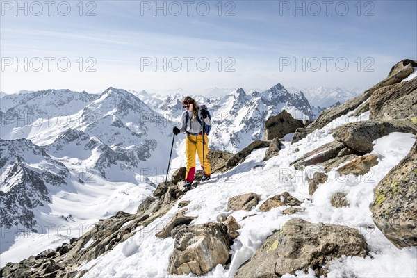 Mountaineer at the summit of the Sulzkogel