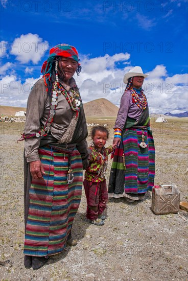 Traditional dressed women with a child