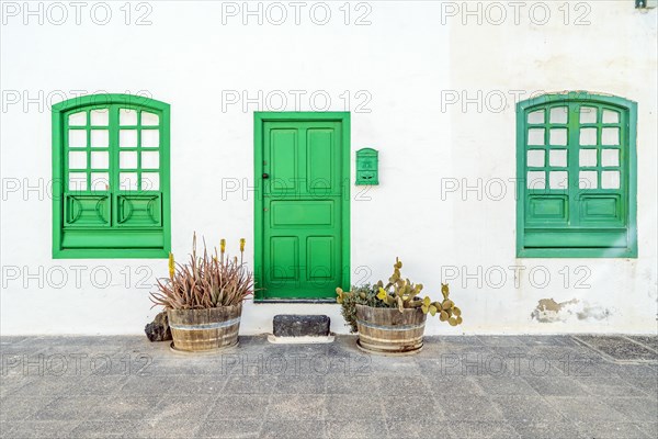 Picturesque white and green settlement called Pueblo Marinero designed by Cesar Manrique located in Costa Teguise