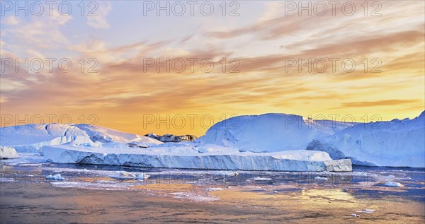 Gigantic icebergs in the evening light