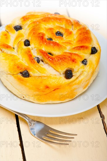 Fresh home baked blueberry bread cake dessert over white wood table