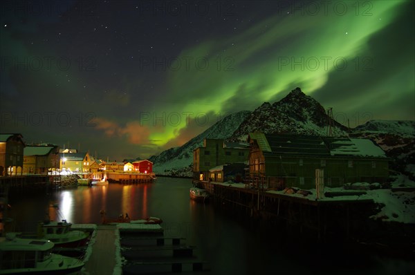 Small harbour with illuminated houses