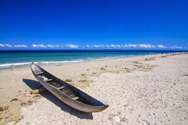 Canoe on a white sand beach on the Island Ile Sainte-Marie although Nosy Boraha