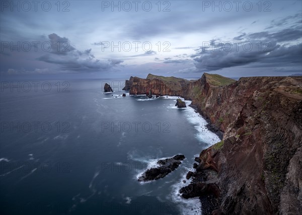 Red cliffs and rocks in the sea