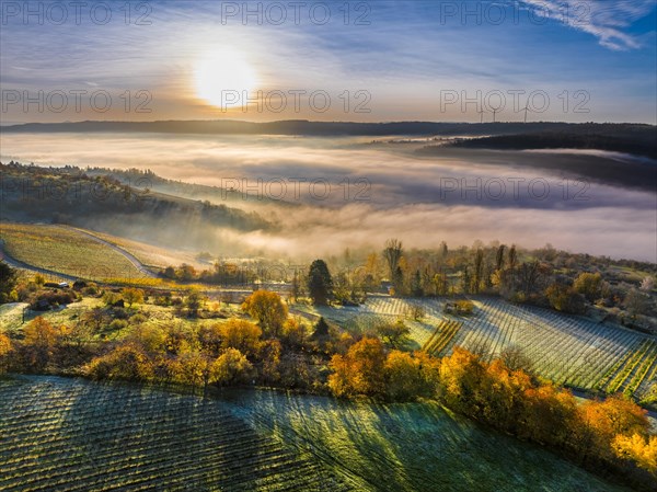 Drone view of sunrise with fog over valley Remstal