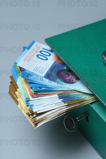 Cash box and Swiss banknotes