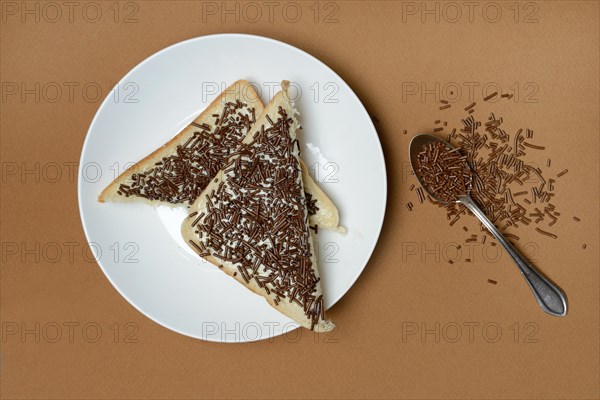 Toast with chocolate sprinkles on plate