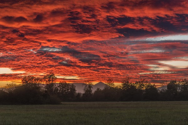 Beautiful glowing sky over the plain at sunset. Alsace