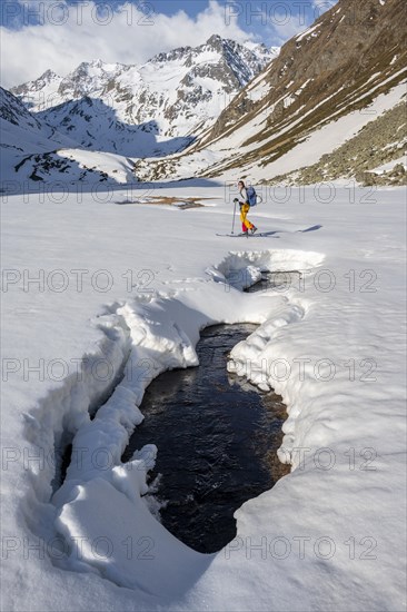 Ski tourers in winter in the mountains