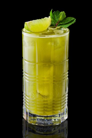 Matcha tea and lime lemonade with mint isolated on black background