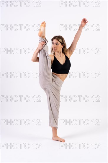 Young dancer in studio photo session with a white background