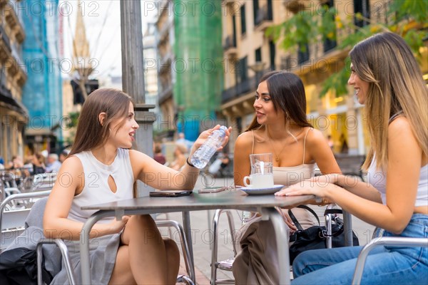 Friends enjoying an afternoon on a cafeteria terrace
