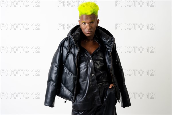 Black ethnic man in studio with white background