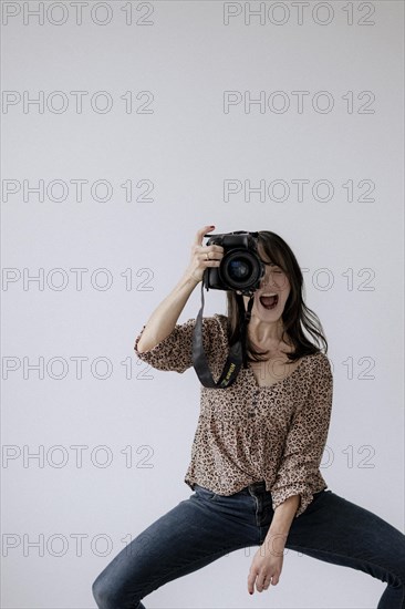 Woman in action with camera