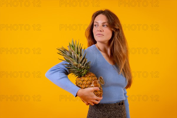 Woman with a pineapple in sunglasses