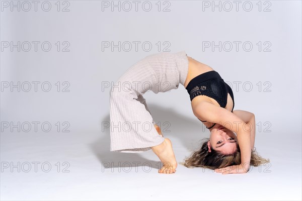 Young dancer in studio photo session with a white background