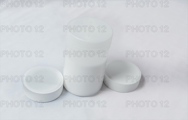 Chlorine tablets for swimming pool disinfection on white background