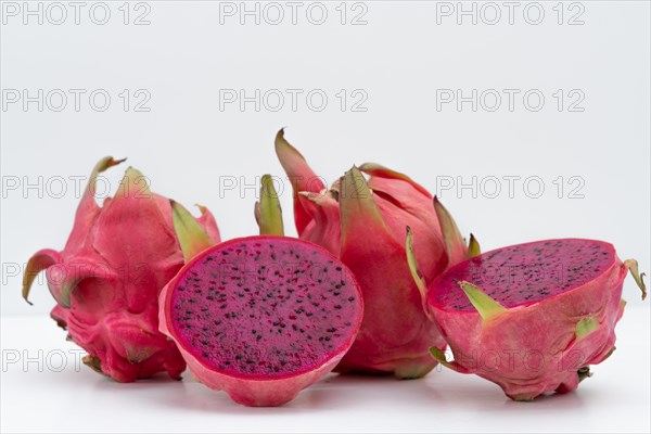 Pink pitahaya or dragon fruit isolated on white background with copy-space