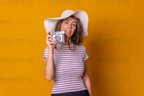 Caucasian girl in tourist concept on a yellow background