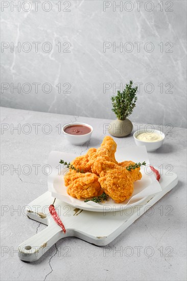 Deep fried chicken in breading on a plate