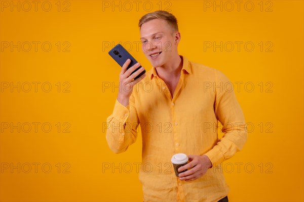 Blond caucasian man on a yellow background