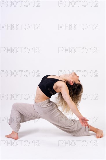 Young dancer in studio photo session with a white background