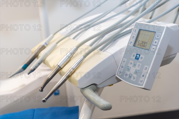 Tools used by doctors in a modern dental clinic next to the chair for operations