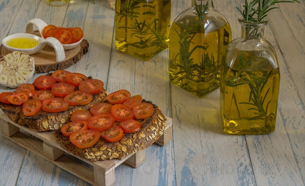 Toast bread with cherry tomato and olive oil with rosemary