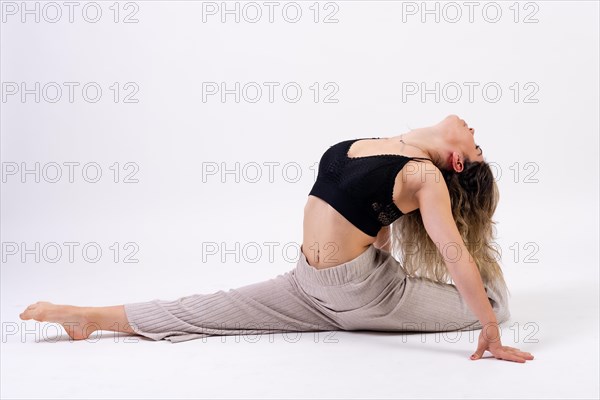 Young dancer in studio photo session with a white background