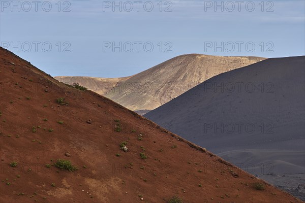 Red flank of a lava hill