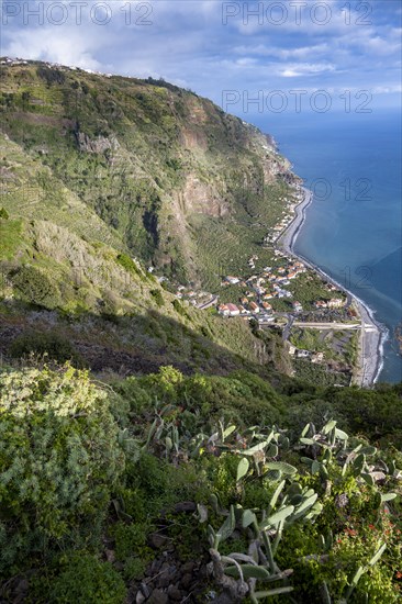 View of the cliffs with the sea and the town of Madalena do Mar