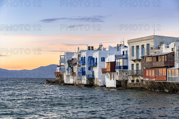 White Cycladic houses on the shore