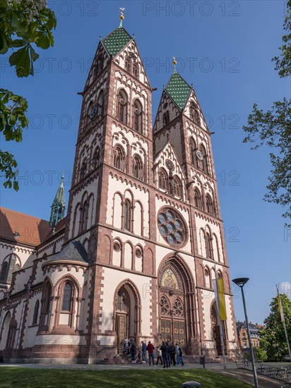 The Church of the Sacred Heart with its two distinctive bell towers with green tiles