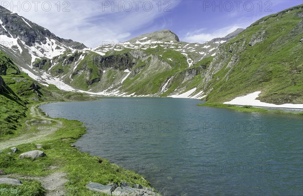 Wet field reservoir with snow remains