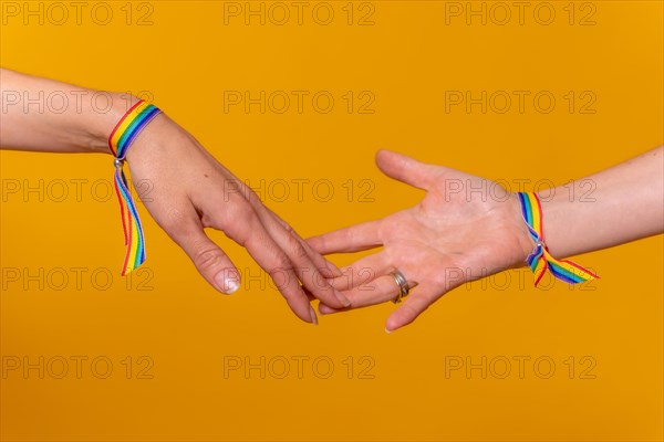 Hands of two women caressing and touching fingers