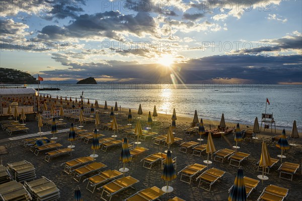 Empty beach and beach loungers