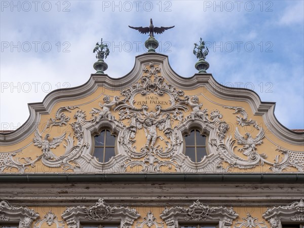 Facade view of the Falkenhaus with stucco facade in rococo style in the centre of Wuerzburg