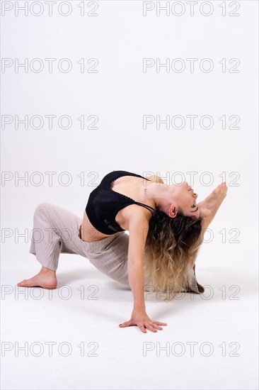 Young dancer in studio photo session with a white background