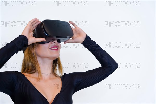 Woman with virtual reality glasses on white background