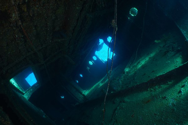 DSC04648 Contrast of light and shadow in the upper deck of the Giannis D create a moody atmosphere. Dive site Giannis D wreck