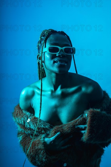 Attractive black ethnic woman with braids with blue led lights