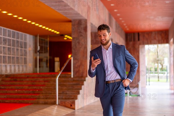 Business or finance corporate man at the entrance of an event in a hotel