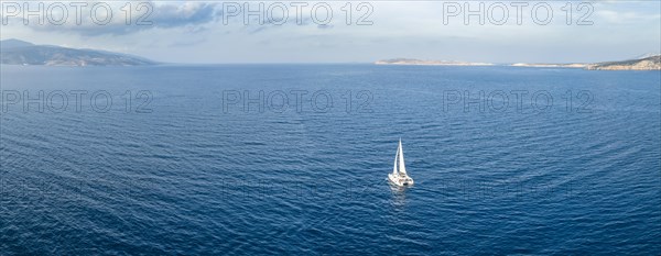 Sailing catamaran in full sail