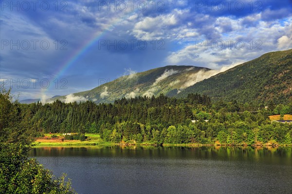 Fjord landscape with rainbow
