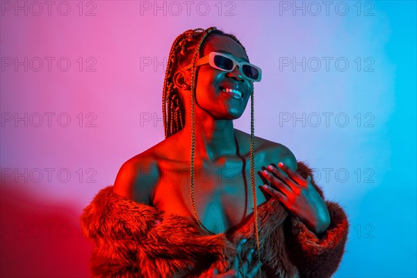Black ethnic woman with braids with red and blue led lights