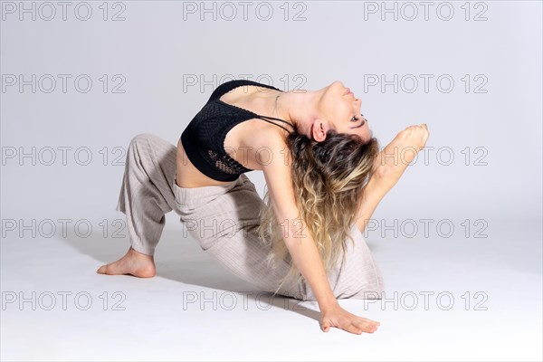 Young dancer in a studio photo session with a white background